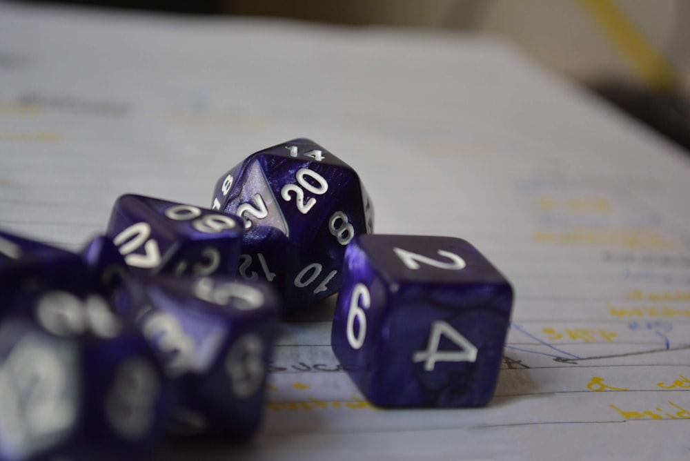 purple-and-white dices on white lined paper