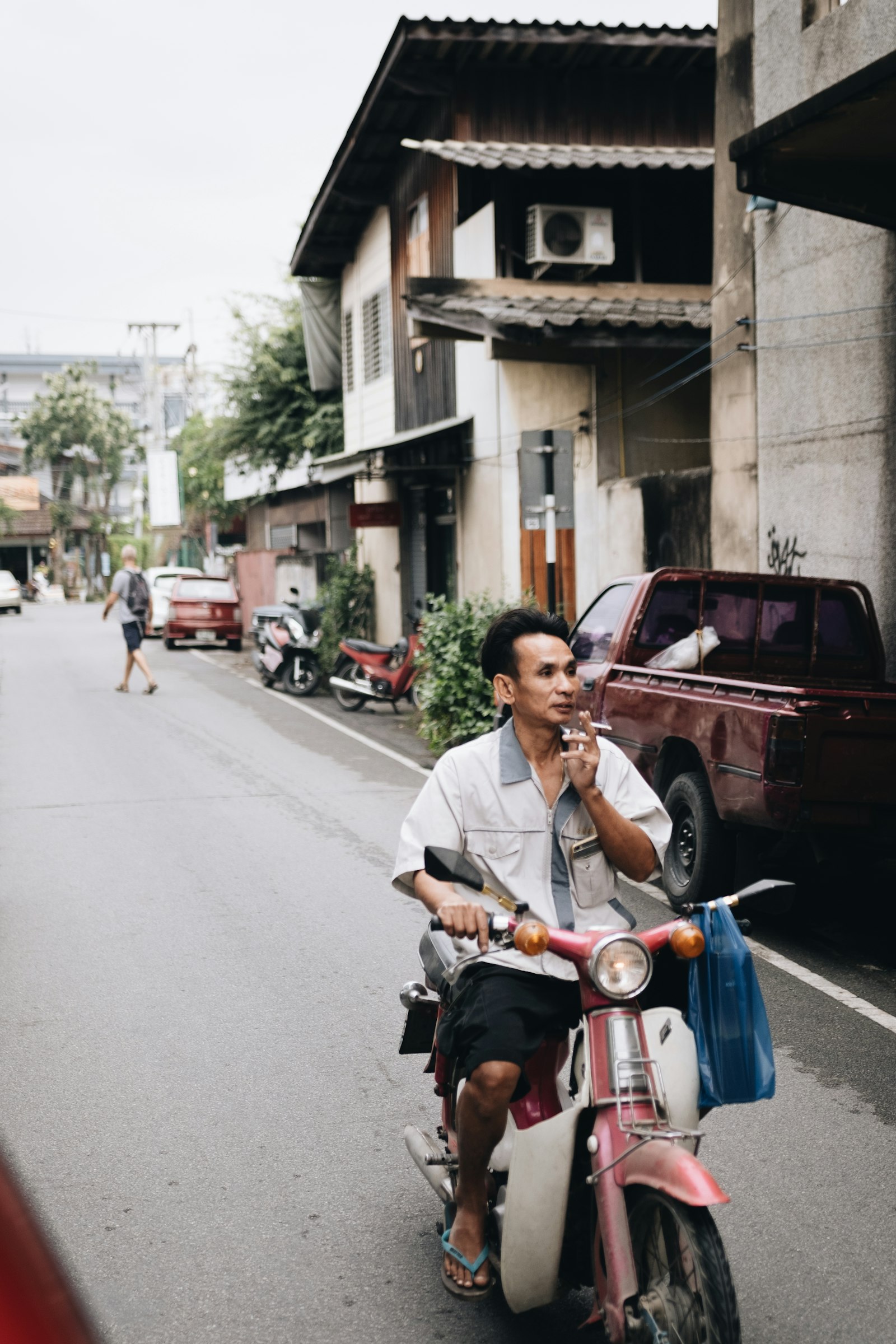 Sigma 18-35mm F1.8 DC HSM Art sample photo. Man driving white and photography