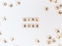 girl boss text on brown background