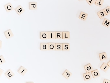 girl boss text on brown background