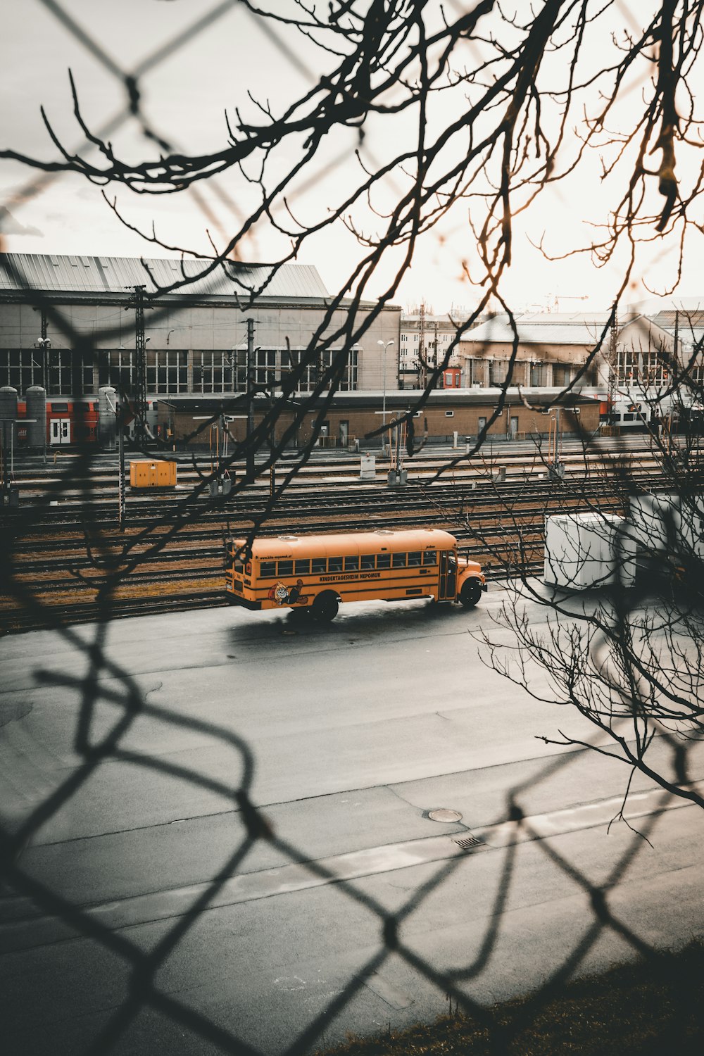 yellow school bus near buildings