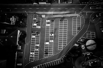 Close-up aerial shot highlighting occupied and empty parking spaces.