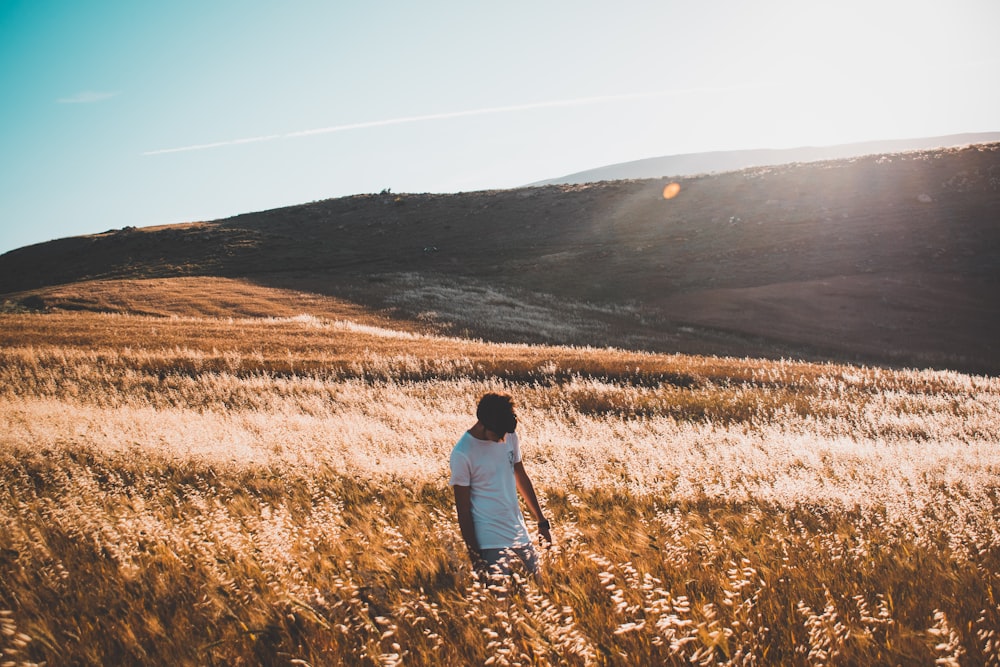 man standing on grasses