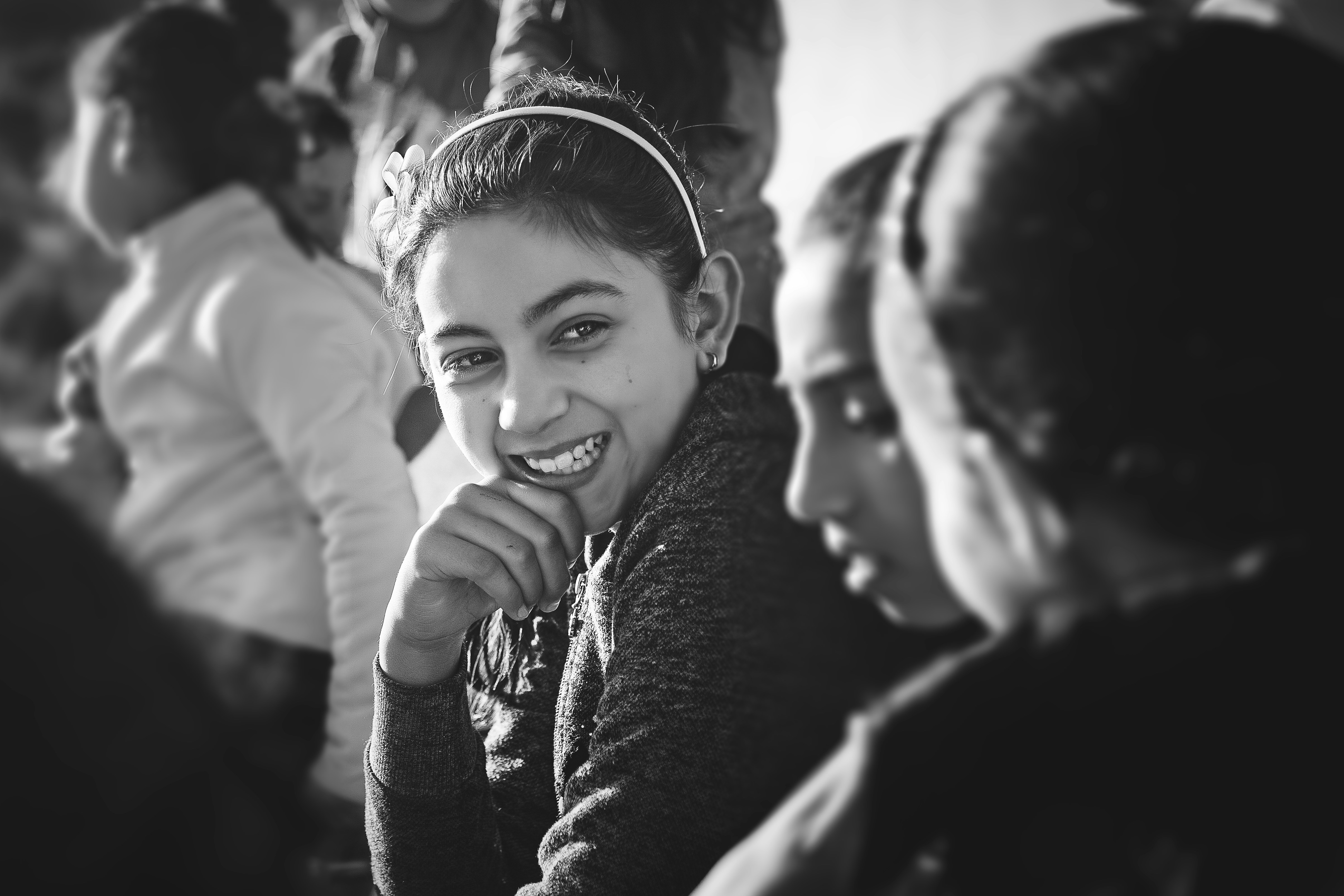 grayscale photo of smiling girl