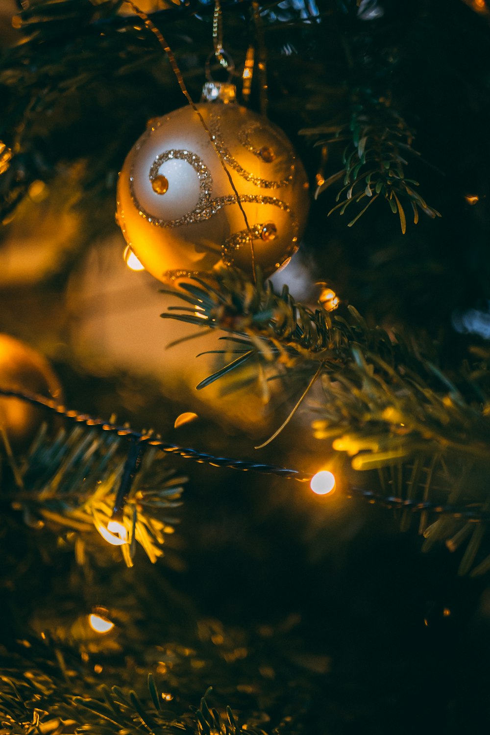 turned-on string light on Christmas tree