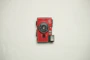 red and black Konica point-and-shoot camera