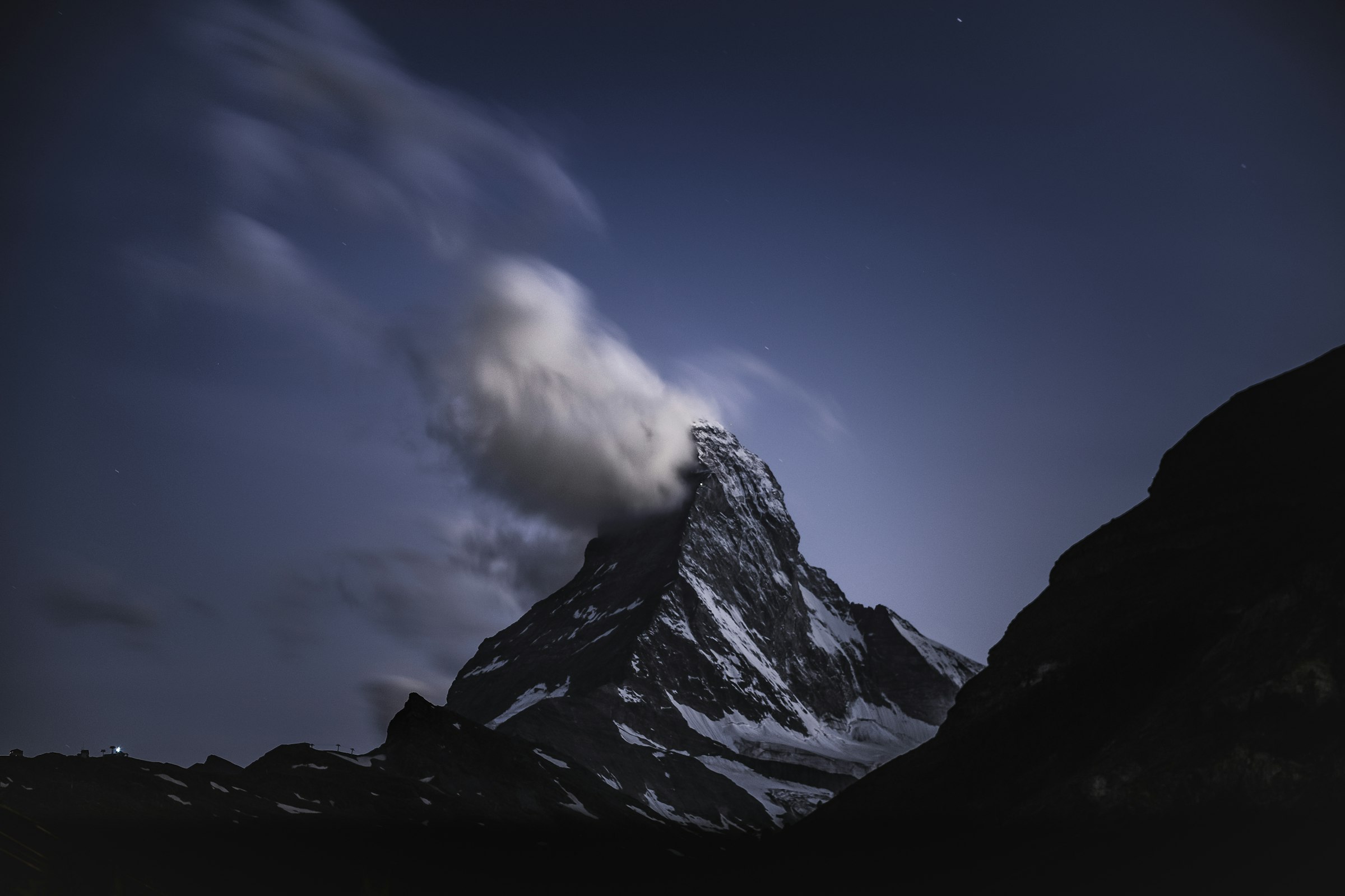 The Matterhorn at night wrapped in cloud