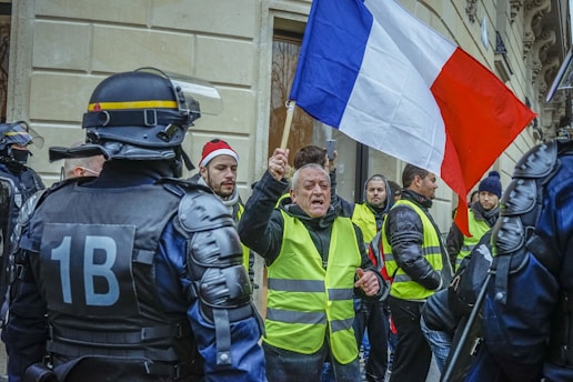 man holding Italy flag surrounded by police officers