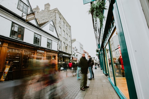 A vibrant storefront of a local bakery with a bustling crowd, showcasing a digital campaign's impact.