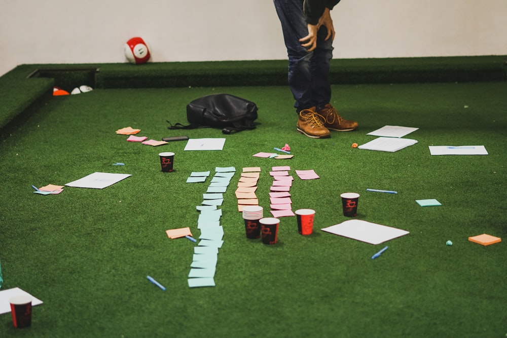 cups on green pool table