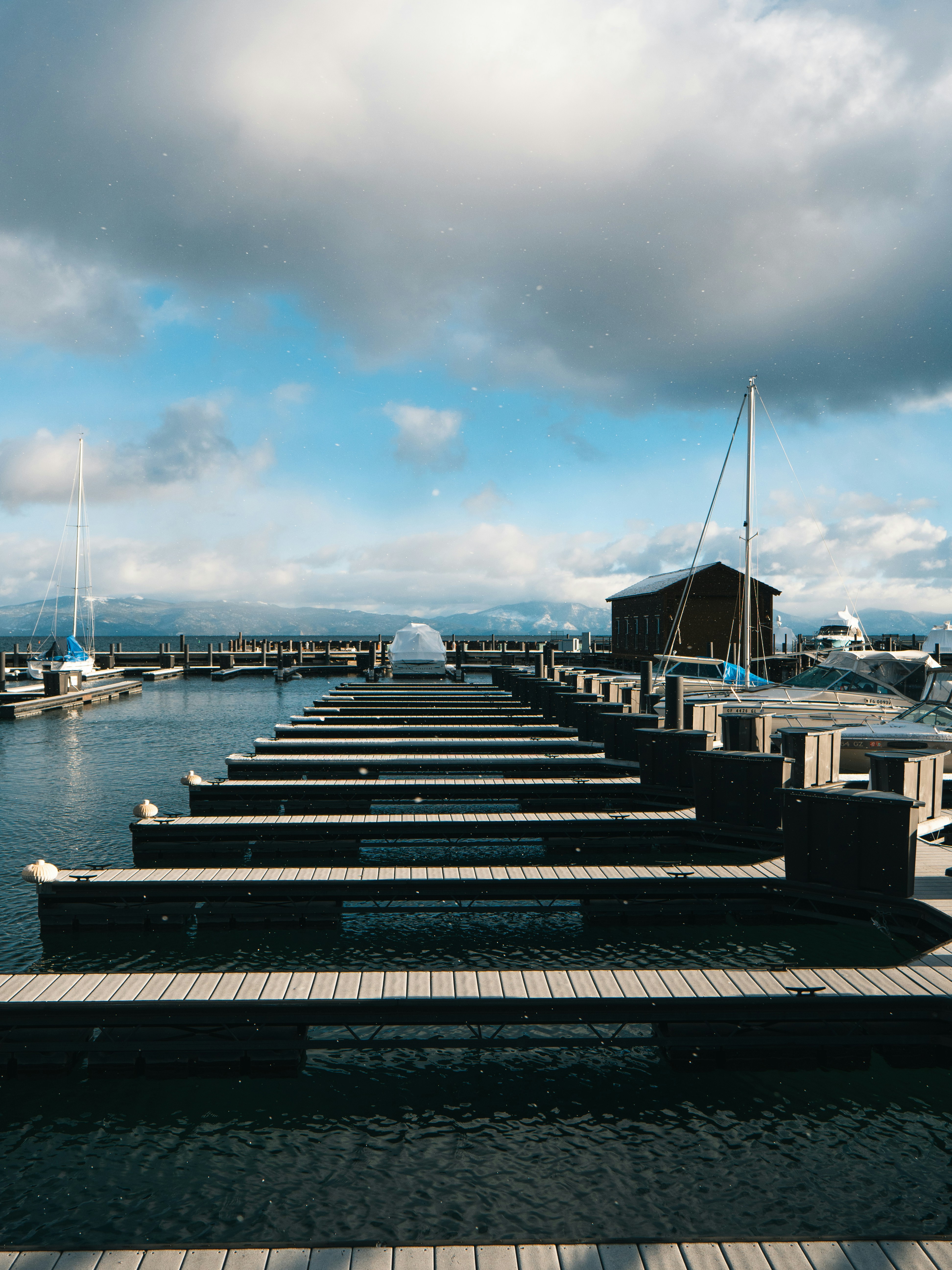 Yacht moored at a dock with fenders and lines