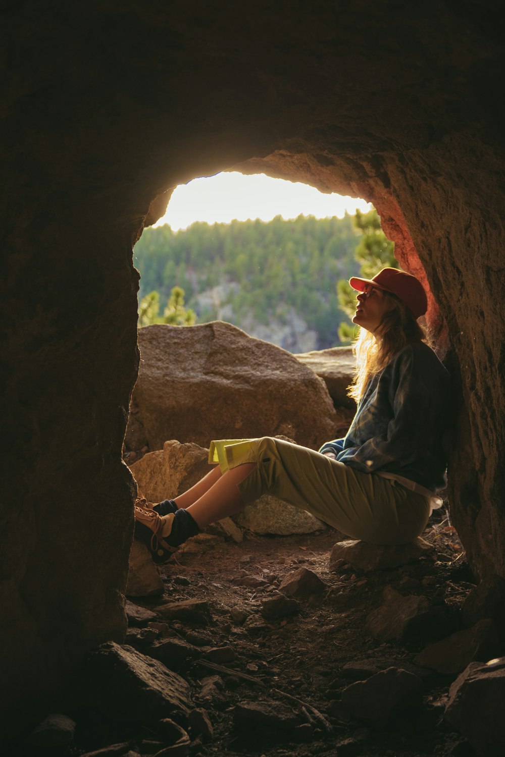 woman sitting inside cave
