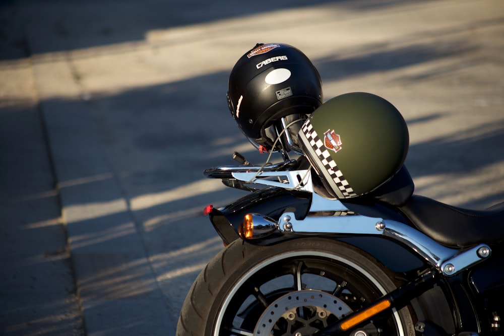 green and black helmet on motorcycle