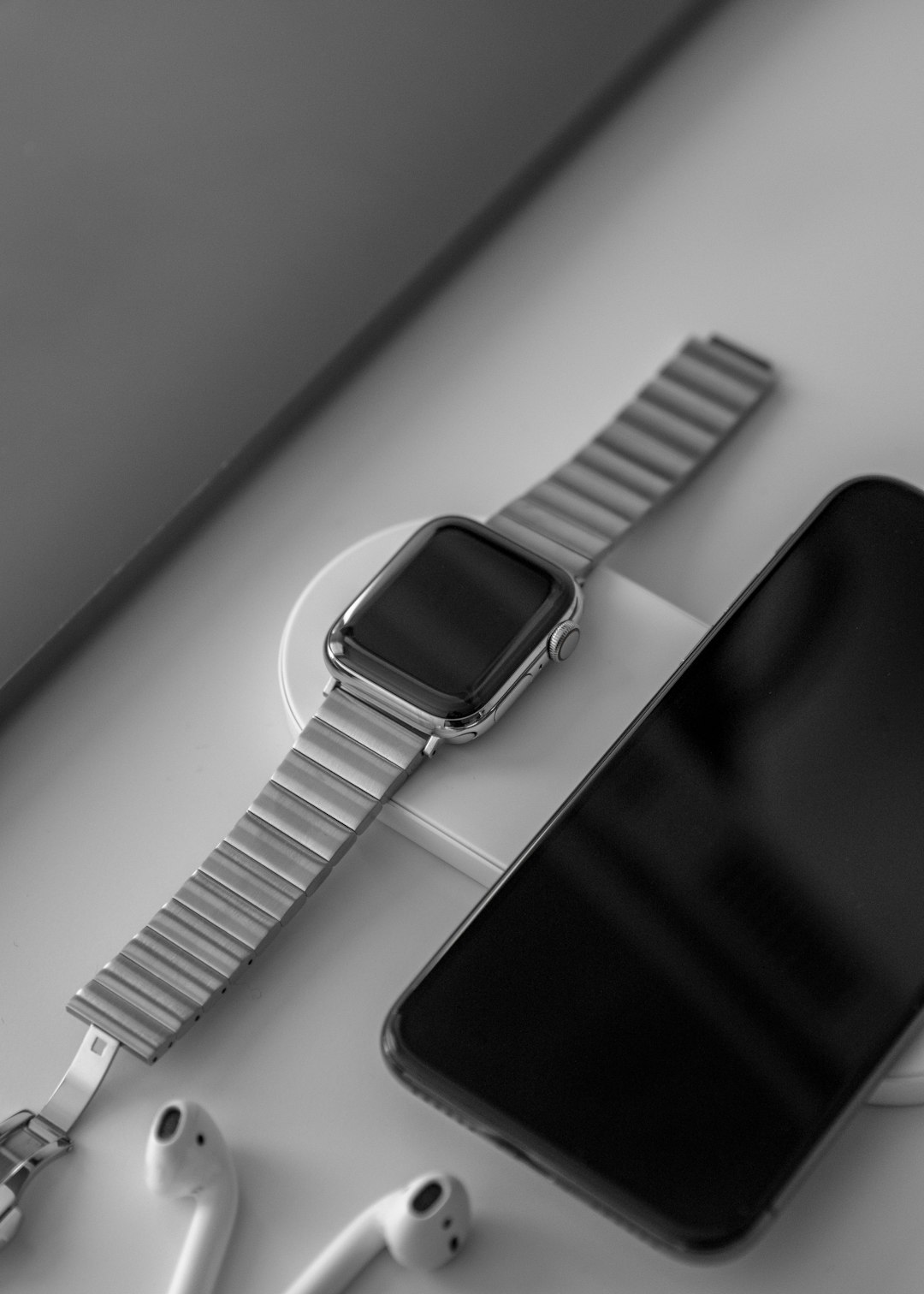 space gray Apple Watch beside space gray iPhone X