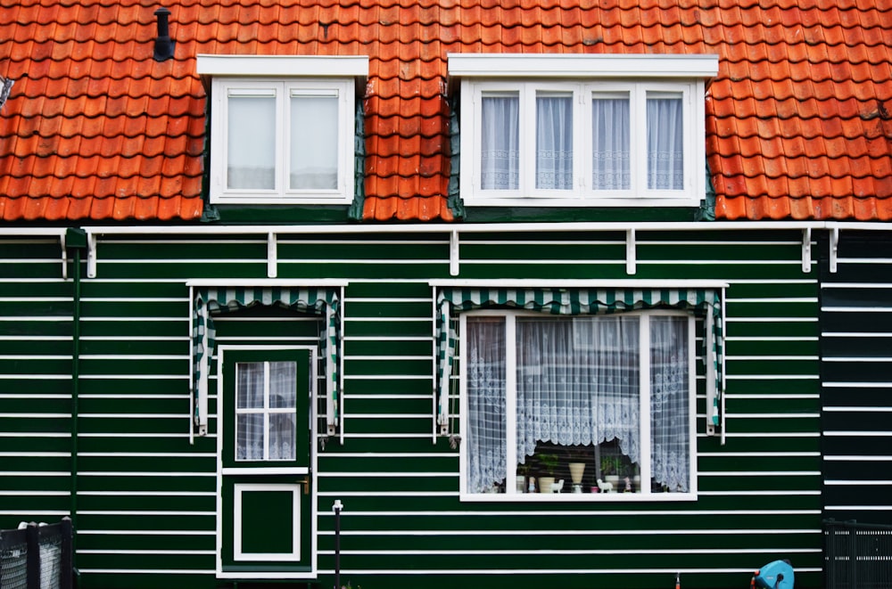 green, white, and brown house