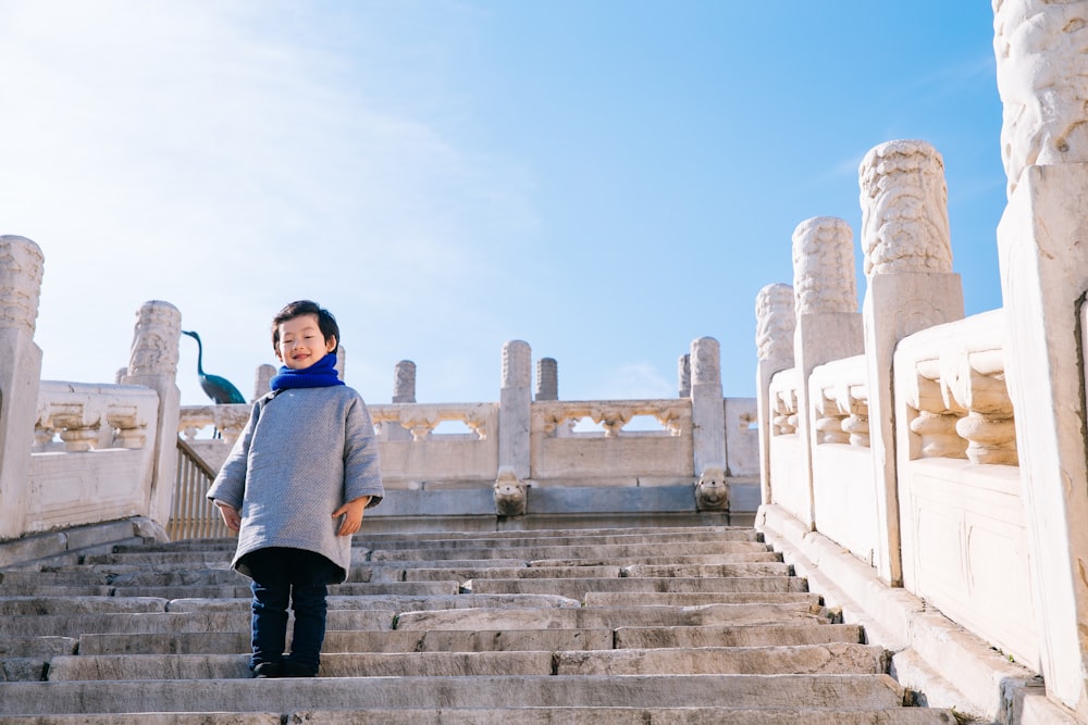 toddler standing on stairs