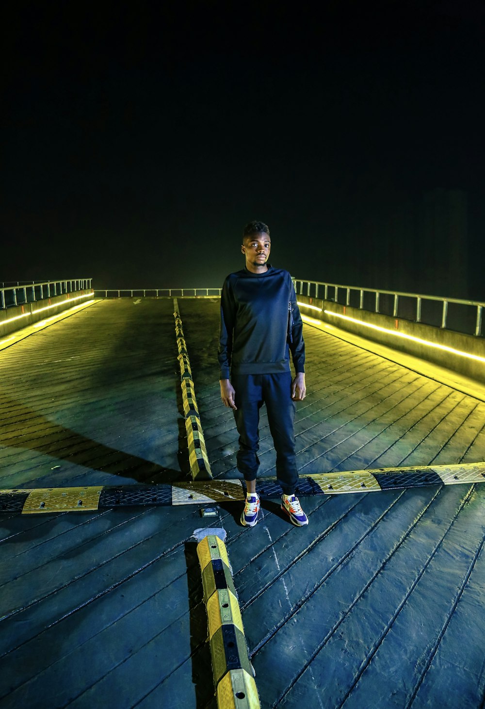 man standing in the middle of the road