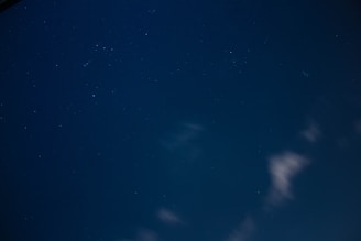 A whimsical illustration of stars and moons in a night sky.