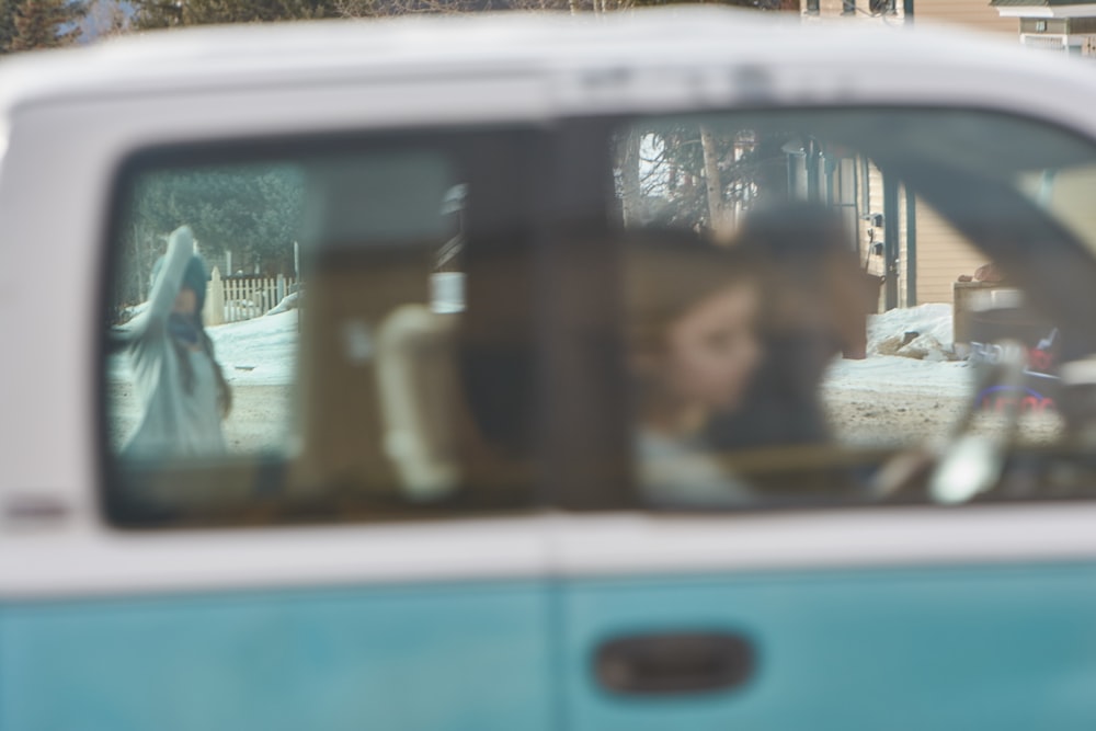 man and woman riding vehicle