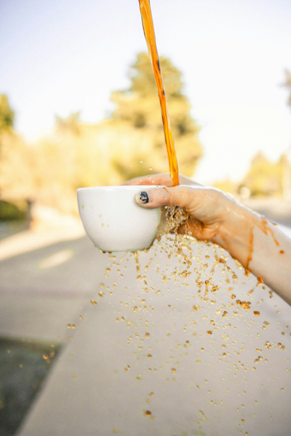 person holding white ceramic mug