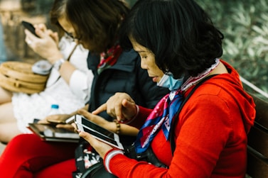 woman using white smartphone