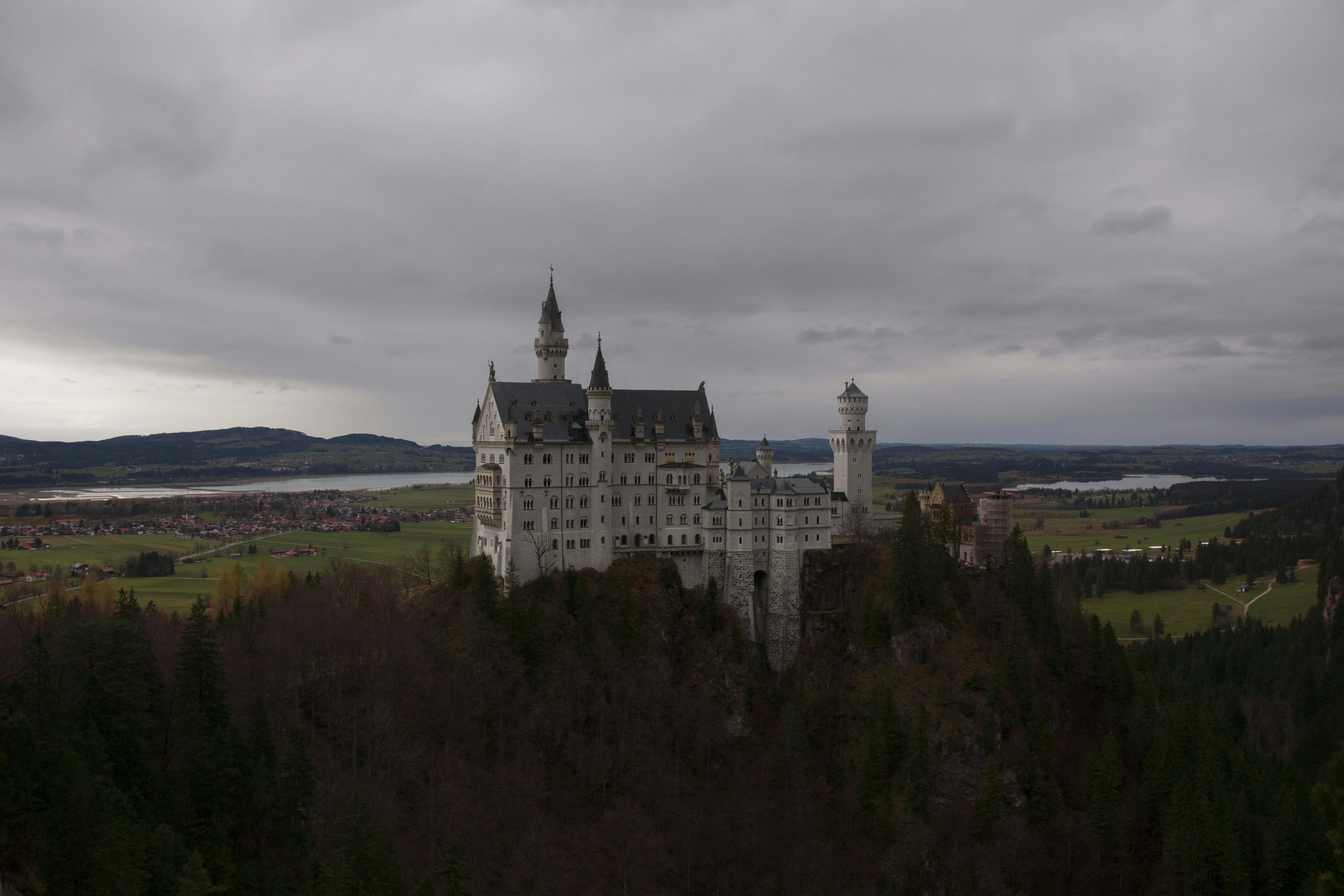 white concrete castle near mountain