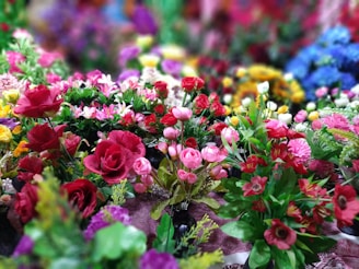 A vibrant display of assorted flowers in various colors and types.