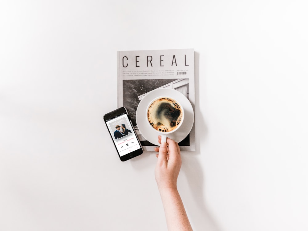 person holding a cup of coffee