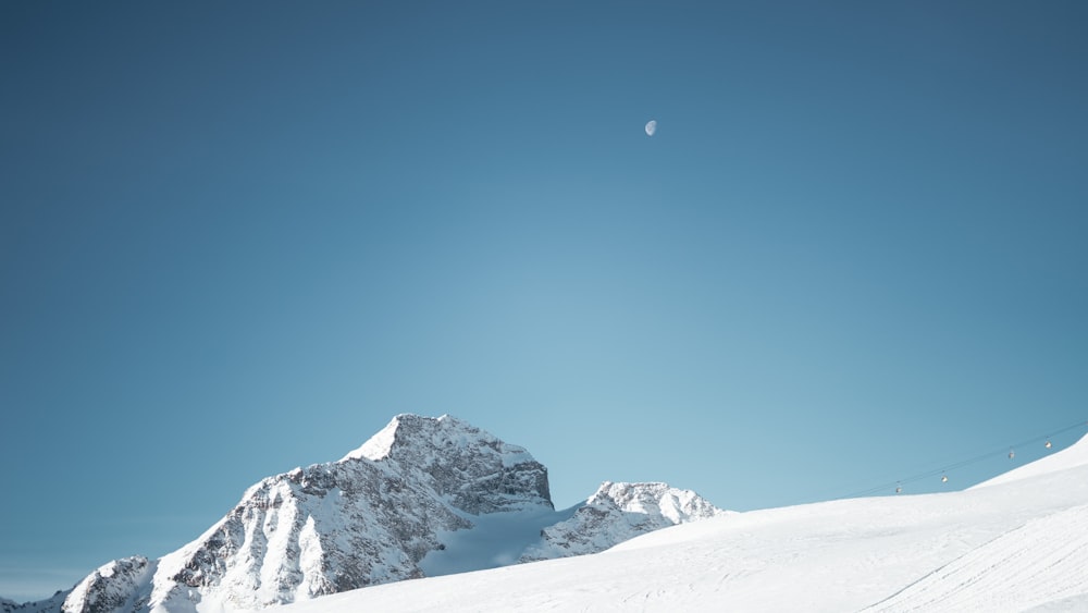 snow covered mountain during day