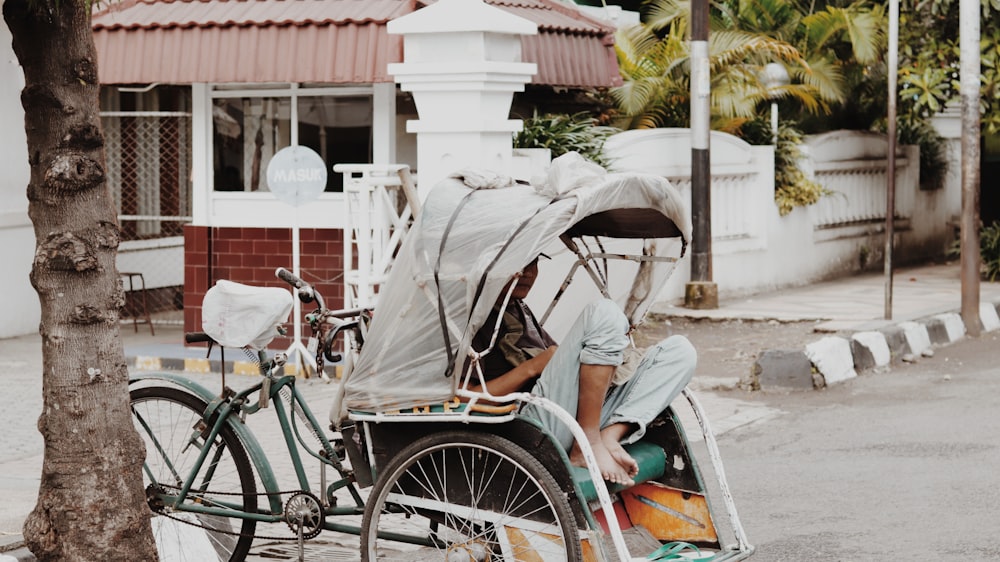 man sitting in trike