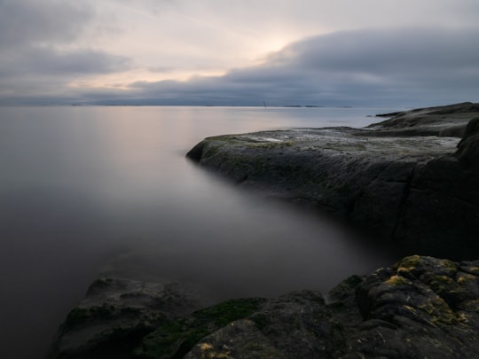 ocean and island during day in Uunisaari Island Finland