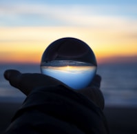 person holding clear glass glass