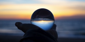 person holding clear glass glass