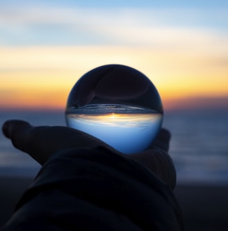 person holding clear glass glass