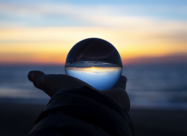 person holding clear glass glass