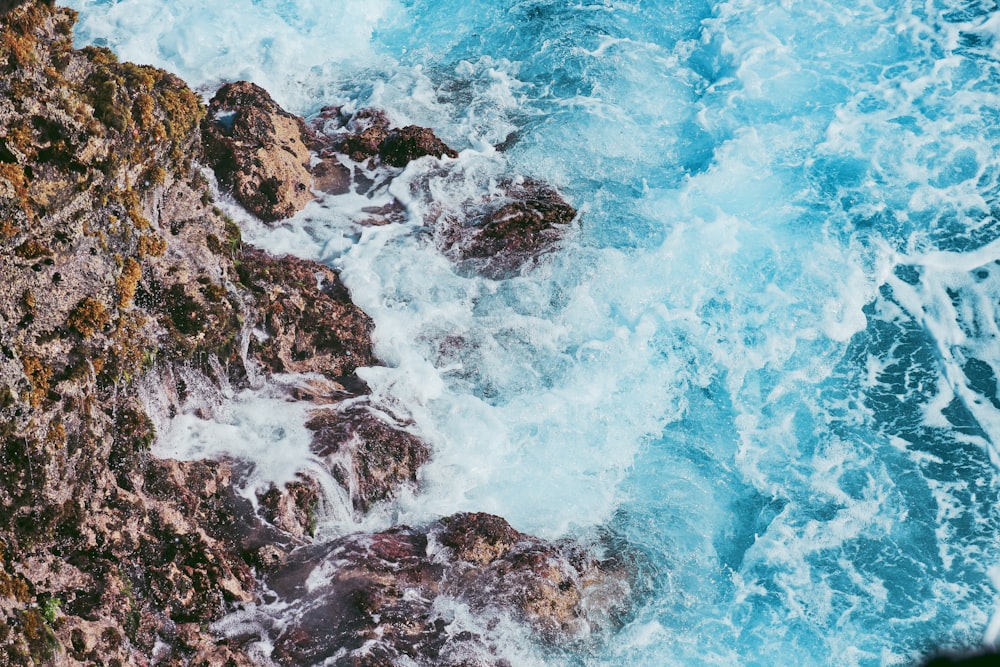 body of water beside hill