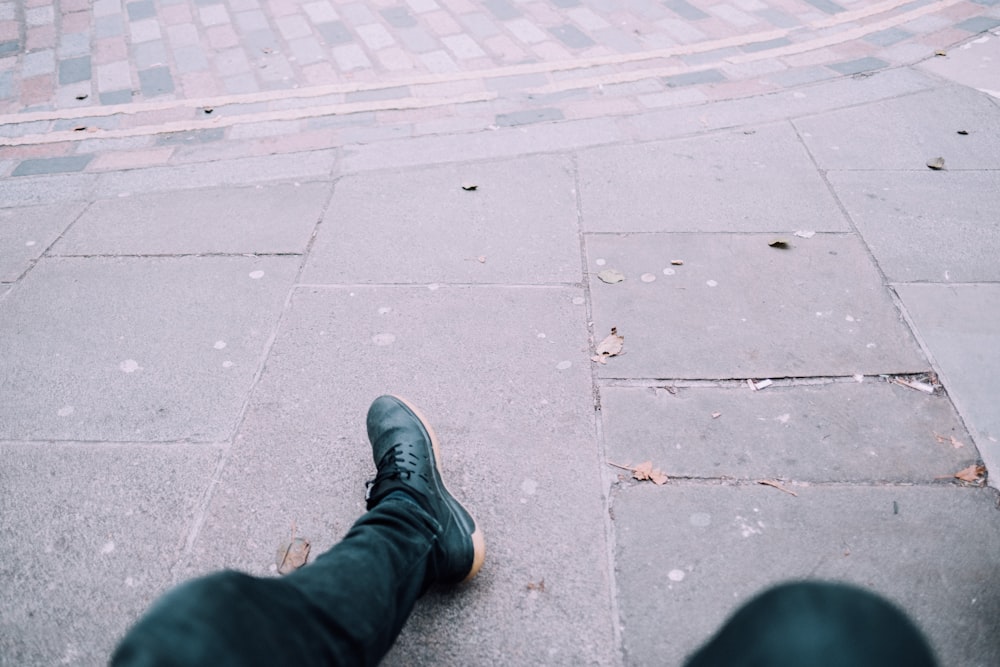 person wearing black shoe