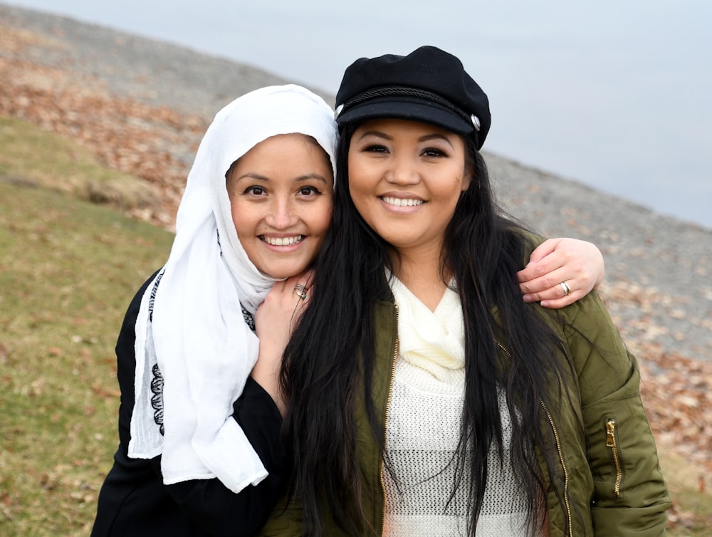 two women taking group photos