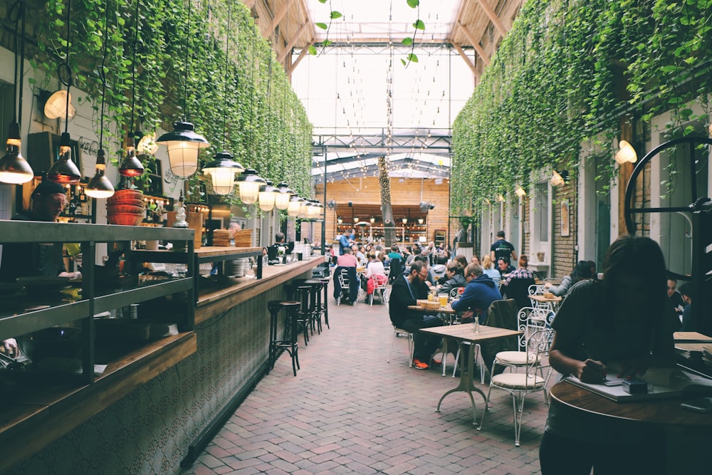 people sitting inside restaurant tables