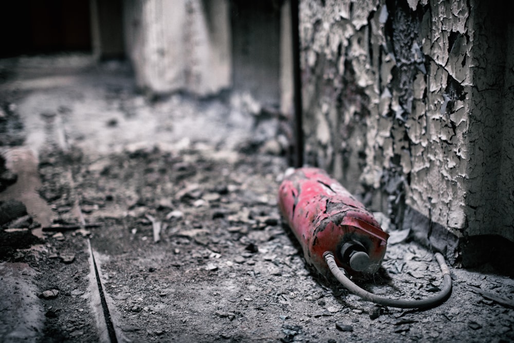 broken red fire extinguisher