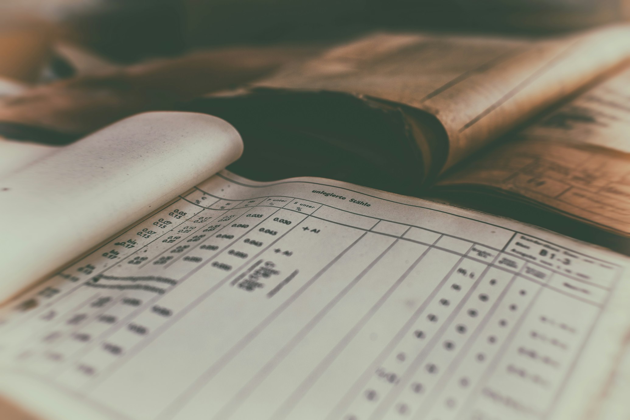 Open vintage ledger book with numerical data and grid layout