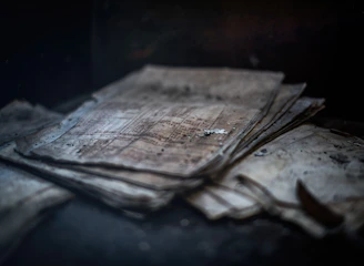 Stacks of documents and reports highlighting incomplete investigations.