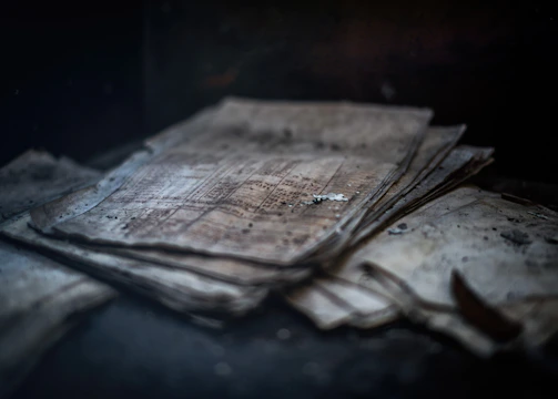 Stacks of documents and reports highlighting incomplete investigations.