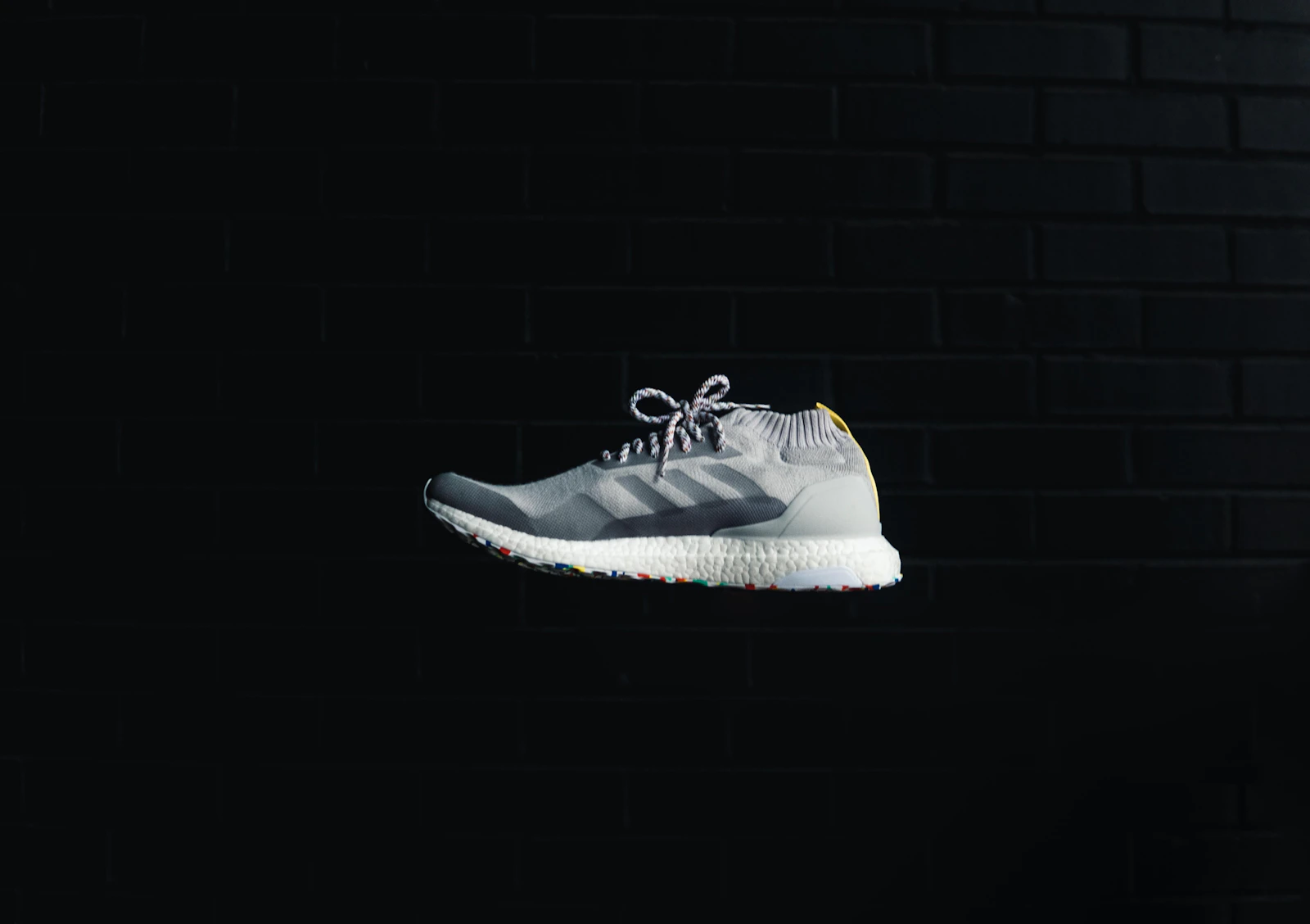 Grey Adidas Ultraboost on black