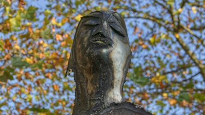Close-up of a metal sculpture glinting in the soft autumn sunlight.
