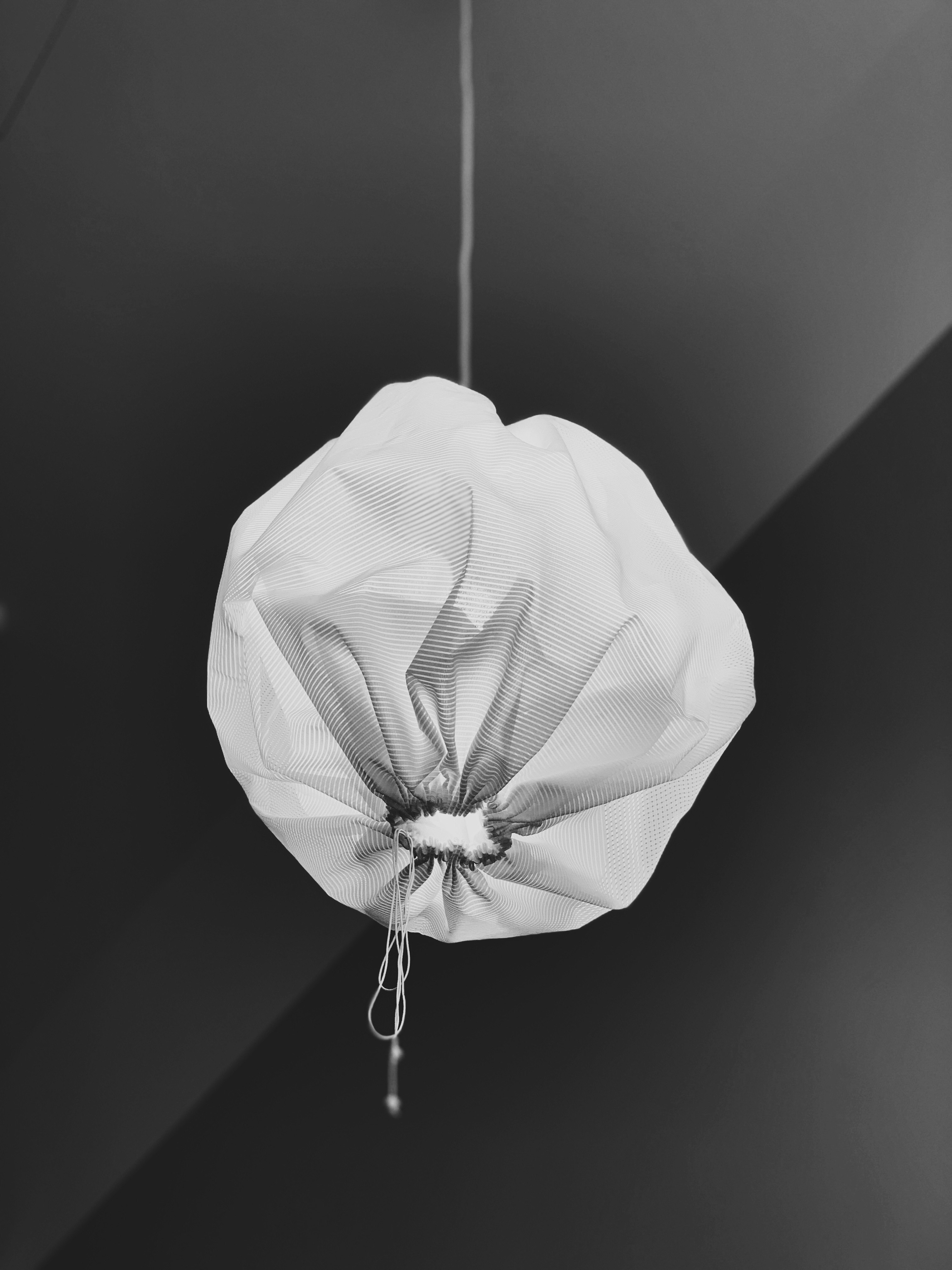 white lantern hanging on ceiling