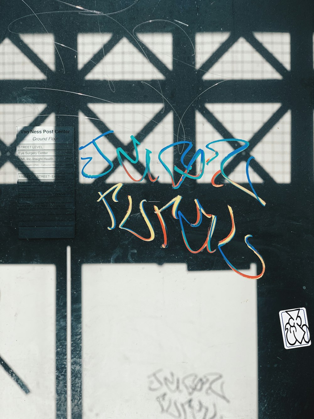 graffiti on clear glass panel