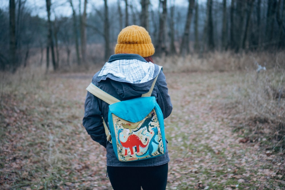 woman wearing blue backpack