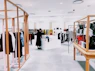 woman standing inside clothing area
