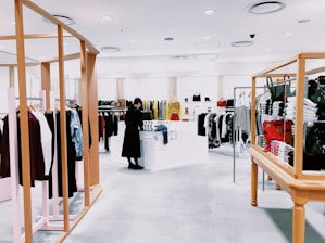 woman standing inside clothing area